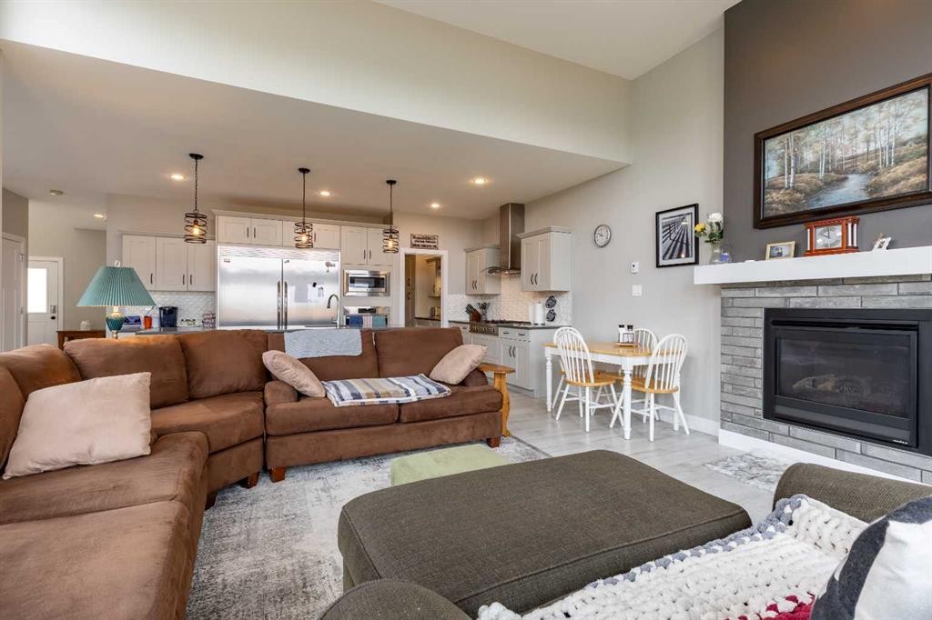 107 Westgate Drive, Coaldale, AB - Indoor Photo Showing Living Room With Fireplace