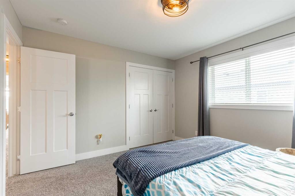 107 Westgate Drive, Coaldale, AB - Indoor Photo Showing Bedroom