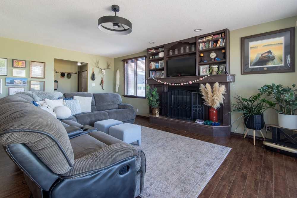 5-94046 Highway 843, Rural Lethbridge County, AB - Indoor Photo Showing Living Room With Fireplace