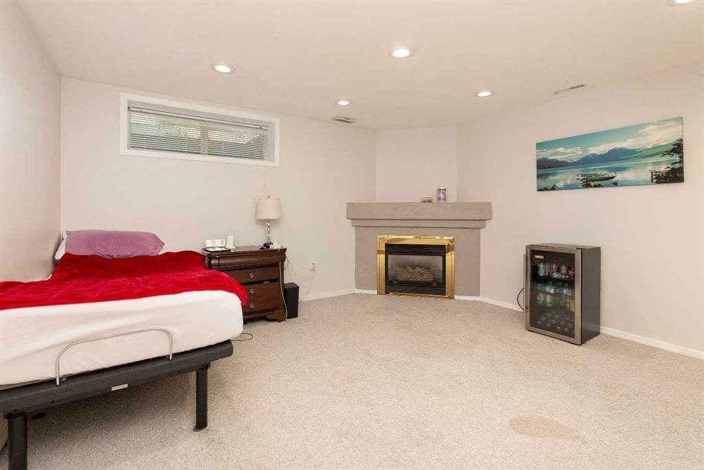 14 Heritage Road West, Lethbridge, AB - Indoor With Fireplace