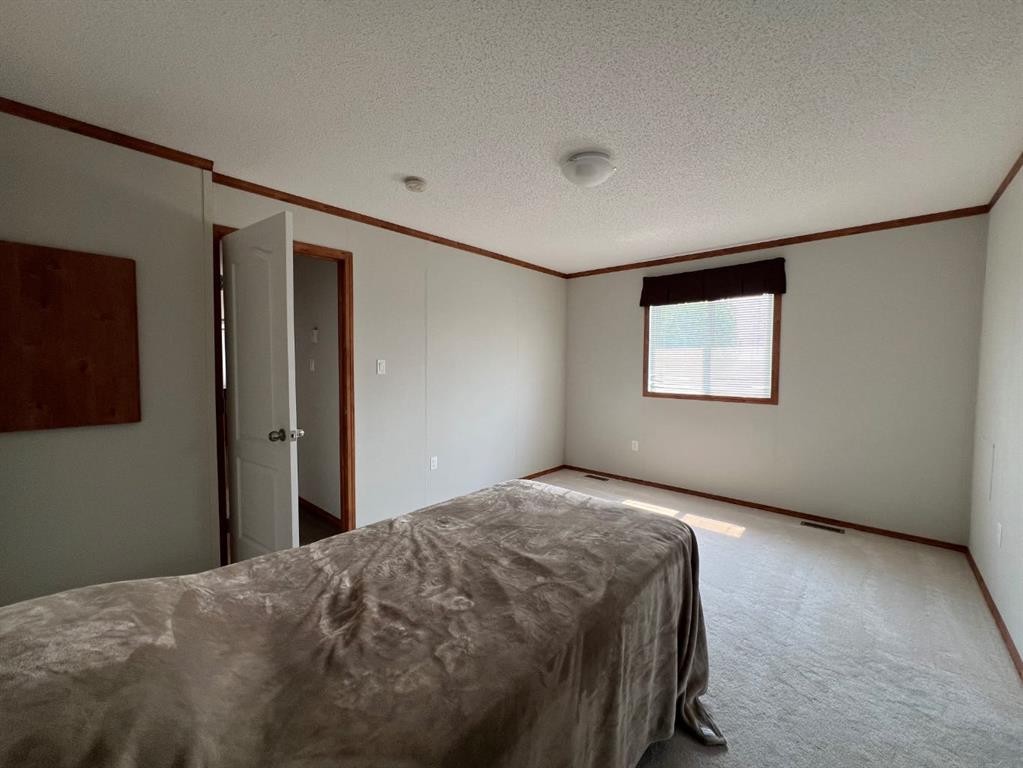 4002 Seasons Boulevard, Coaldale, AB - Indoor Photo Showing Bedroom