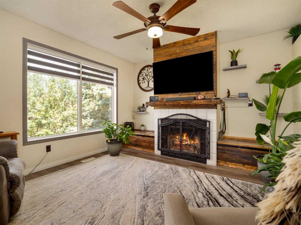 2501 & 2503 24 Street, Coaldale, AB - Indoor Photo Showing Living Room With Fireplace