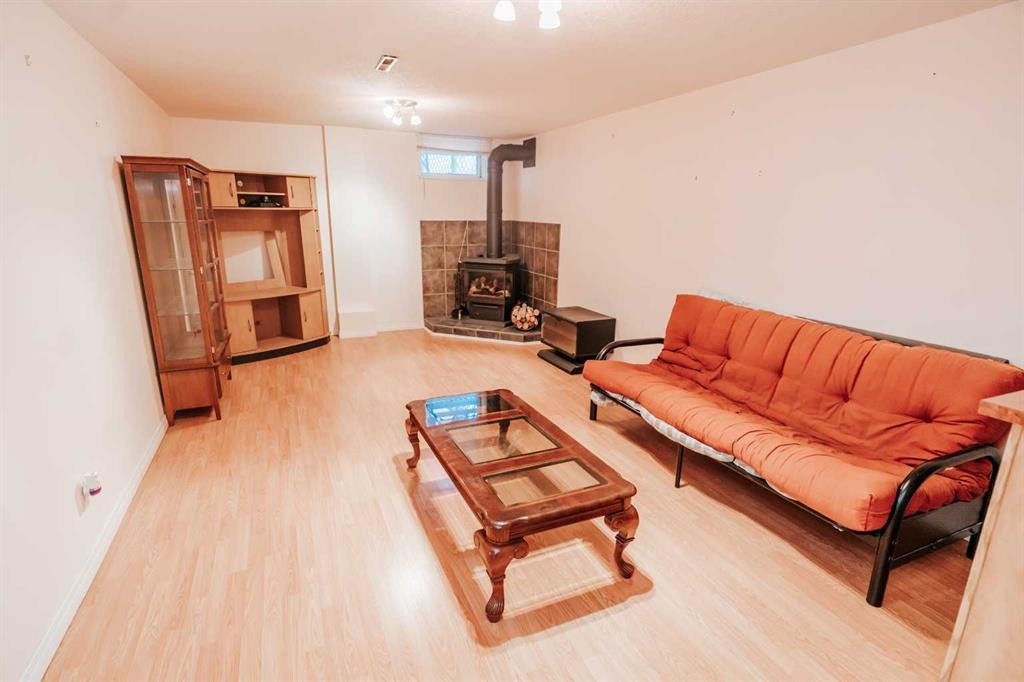 2305 7 Avenue North, Lethbridge, AB - Indoor Photo Showing Living Room With Fireplace