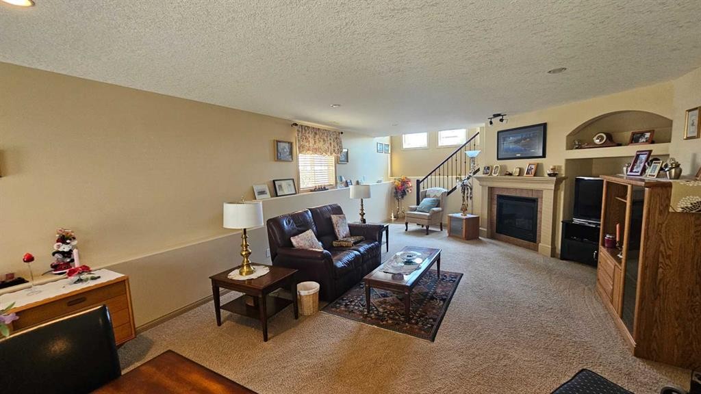 414 Gateway Crescent South, Lethbridge, AB - Indoor Photo Showing Living Room With Fireplace