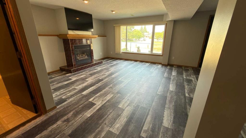47 Chilcotin Crescent West, Lethbridge, AB - Indoor With Fireplace
