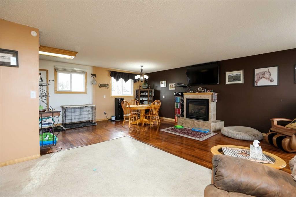 210 Macewan Street, Granum, AB - Indoor Photo Showing Living Room With Fireplace
