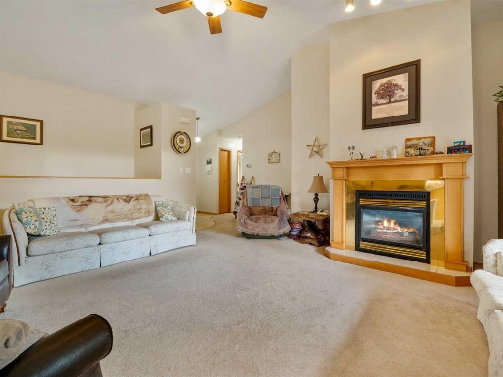 123 Fairway Drive, Coaldale, AB - Indoor Photo Showing Living Room With Fireplace