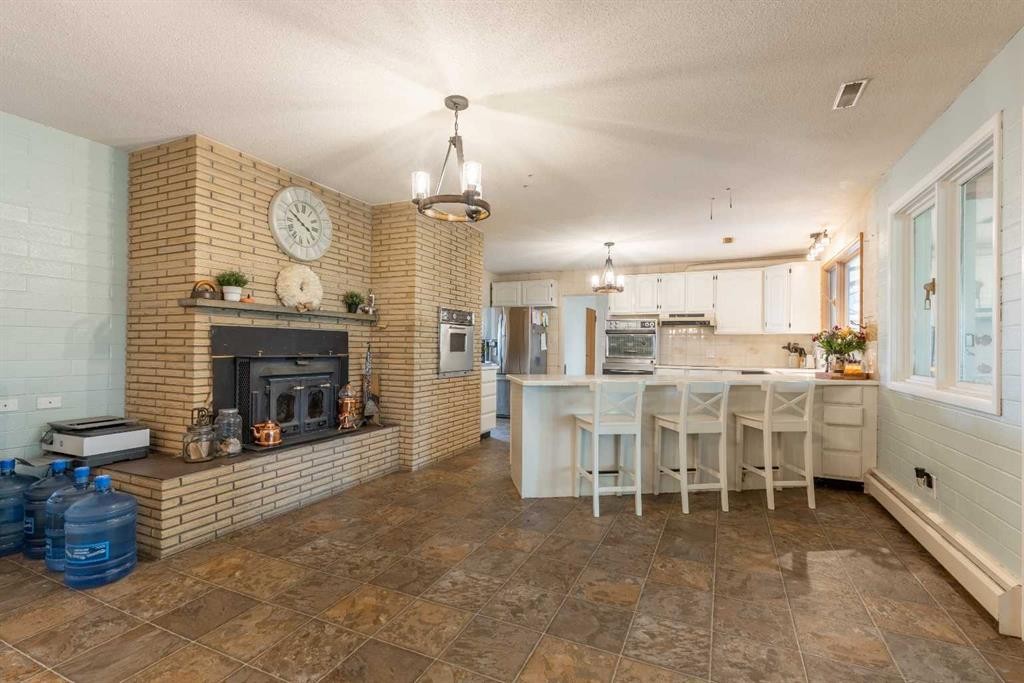54032 Rr 20-2, Raymond, AB - Indoor With Fireplace