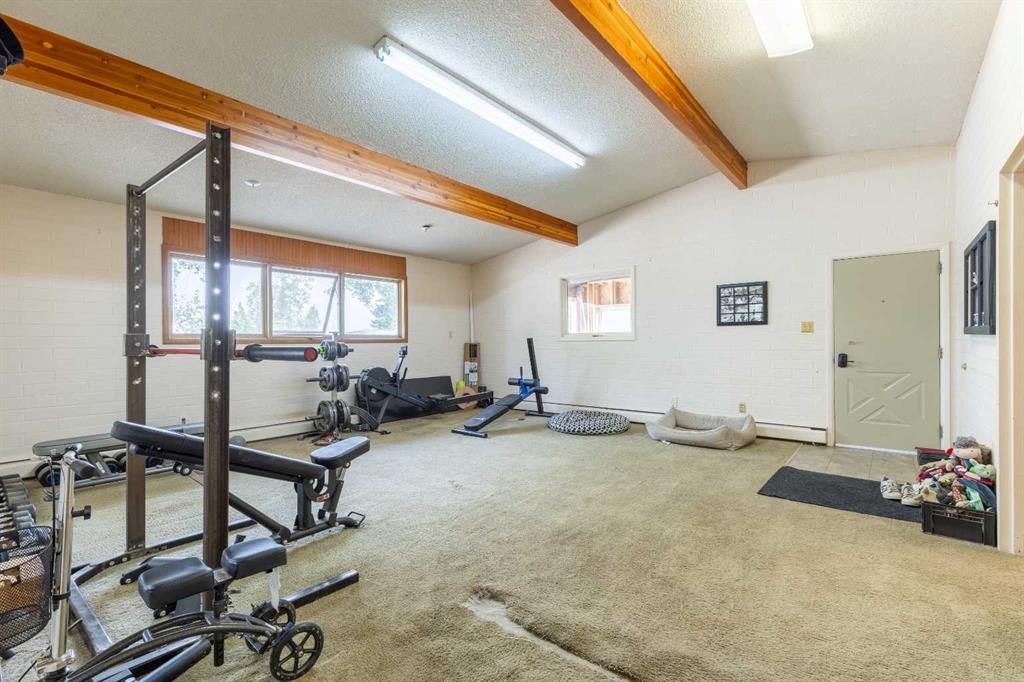 54032 Rr 20-2, Raymond, AB - Indoor Photo Showing Gym Room