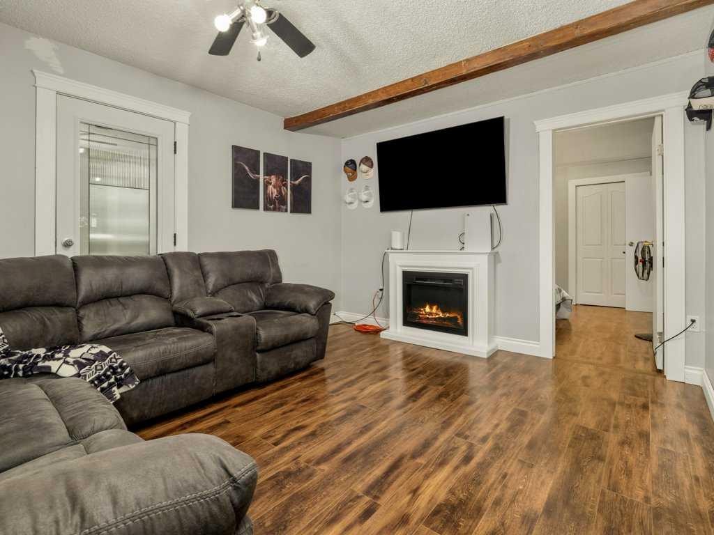 1503 20 Street, Coaldale, AB - Indoor Photo Showing Living Room With Fireplace