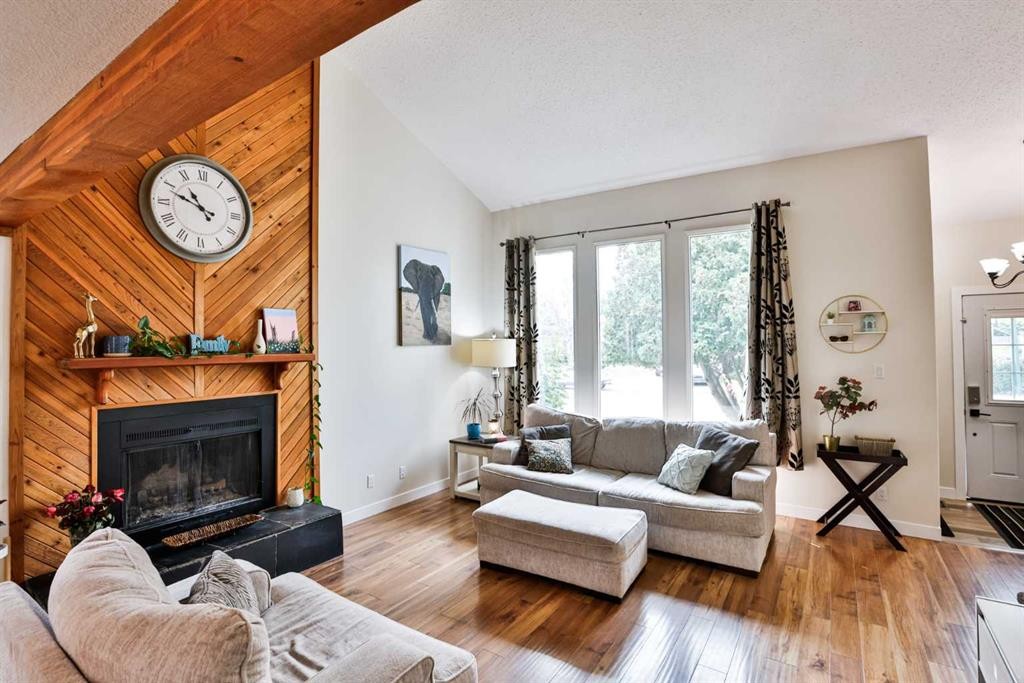 100 Eton Road West, Lethbridge, AB - Indoor Photo Showing Living Room With Fireplace