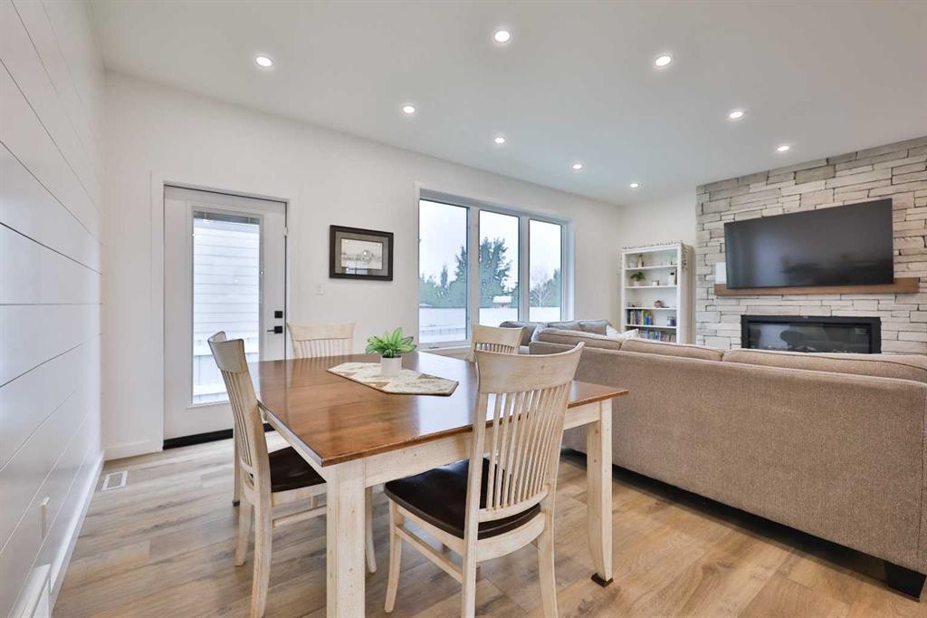 246 4A Street, Stirling, AB - Indoor Photo Showing Dining Room With Fireplace
