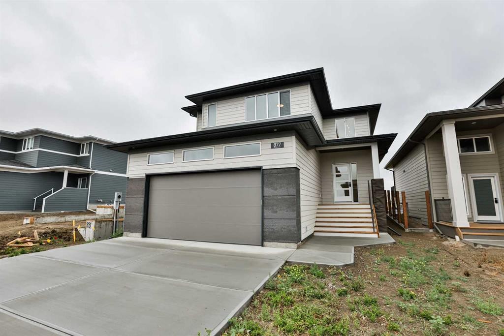 877 Devonia Circle West, Lethbridge, AB - Outdoor With Facade