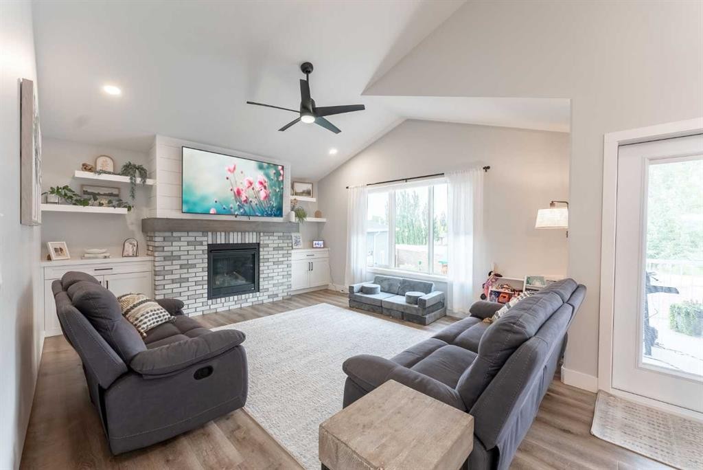2006 30A Avenue, Coaldale, AB - Indoor Photo Showing Living Room With Fireplace
