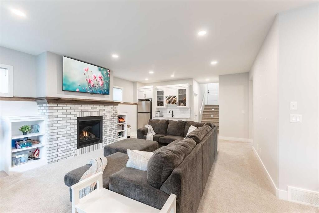2006 30A Avenue, Coaldale, AB - Indoor Photo Showing Living Room With Fireplace