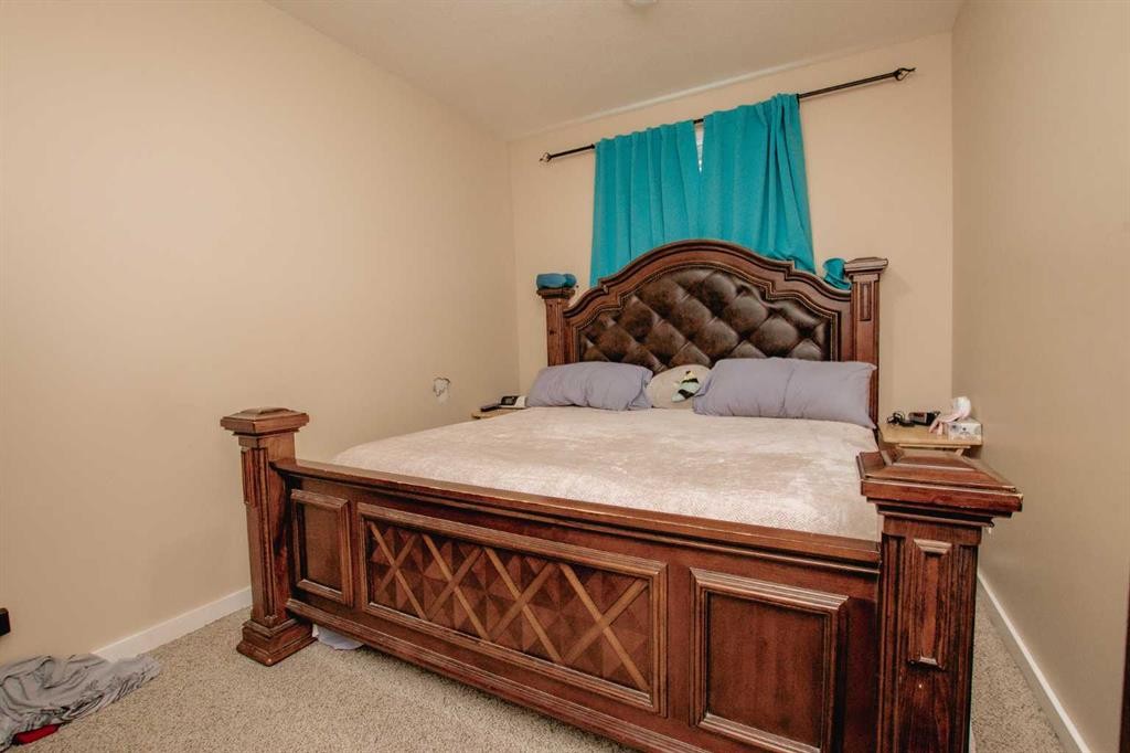 A&B-10028 104 Avenue, Grande Prairie, AB - Indoor Photo Showing Bedroom