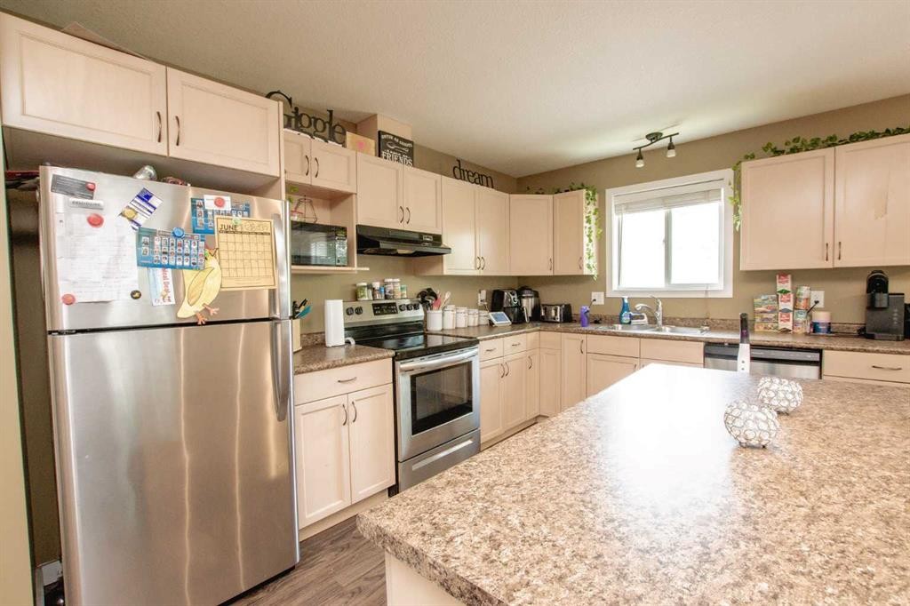 A&B-10028 104 Avenue, Grande Prairie, AB - Indoor Photo Showing Kitchen With Double Sink