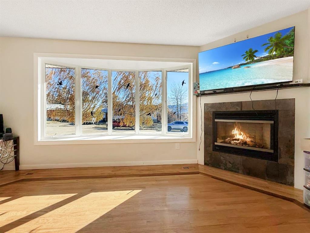 10530 98Th Avenue, Grande Cache, AB - Indoor Photo Showing Living Room With Fireplace