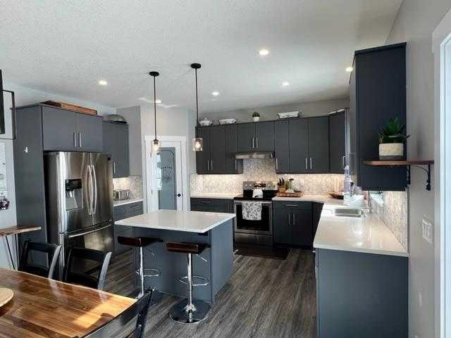 11-1049 Alberta Avenue, Debolt, AB - Indoor Photo Showing Kitchen With Double Sink With Upgraded Kitchen