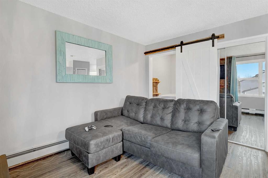 1209-7201 Poplar Drive, Grande Prairie, AB - Indoor Photo Showing Living Room