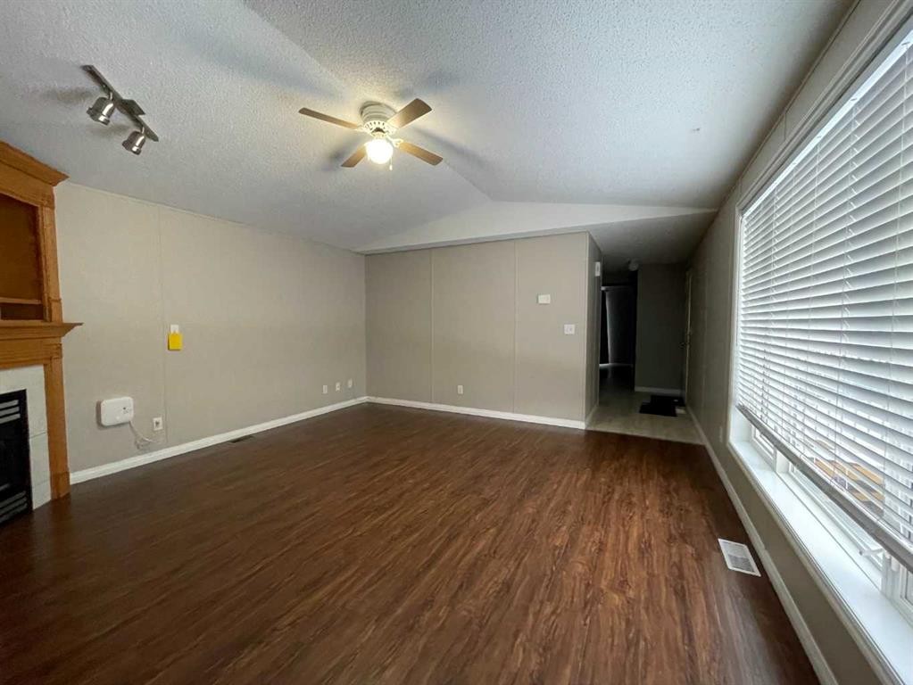 7 Deer Ridge Drive, High Level, AB - Indoor Photo Showing Other Room With Fireplace
