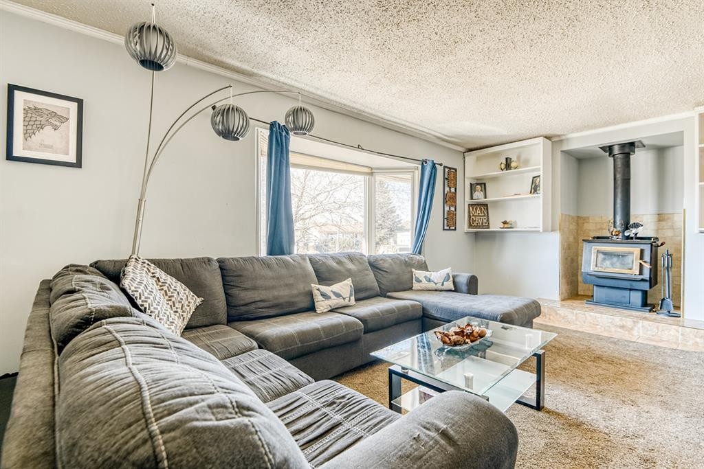 9645 Hillcrest Drive, Grande Prairie, AB - Indoor Photo Showing Living Room With Fireplace