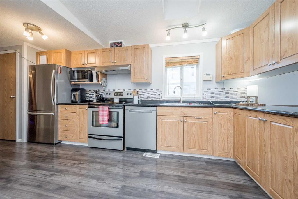 9703 111 Avenue, Clairmont, AB - Indoor Photo Showing Kitchen With Double Sink