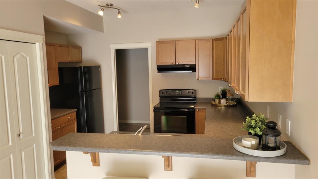 101C-8640 103 Avenue, Grande Prairie, AB - Indoor Photo Showing Kitchen