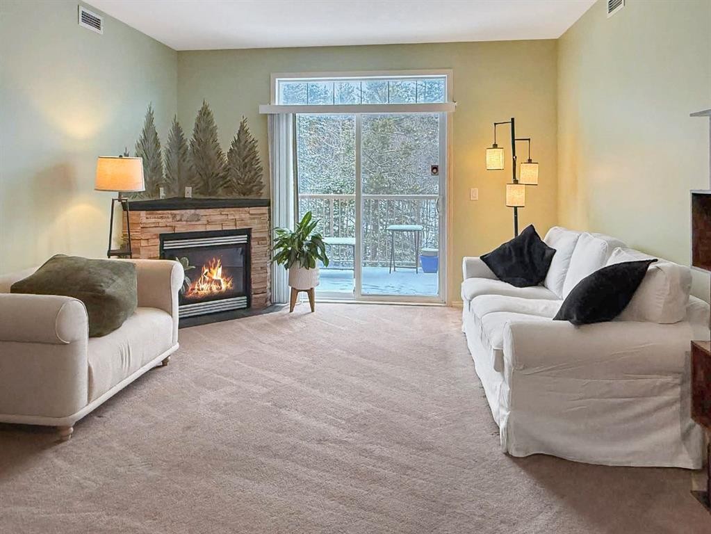 306-160 Moberly, Grande Cache, AB - Indoor Photo Showing Living Room With Fireplace