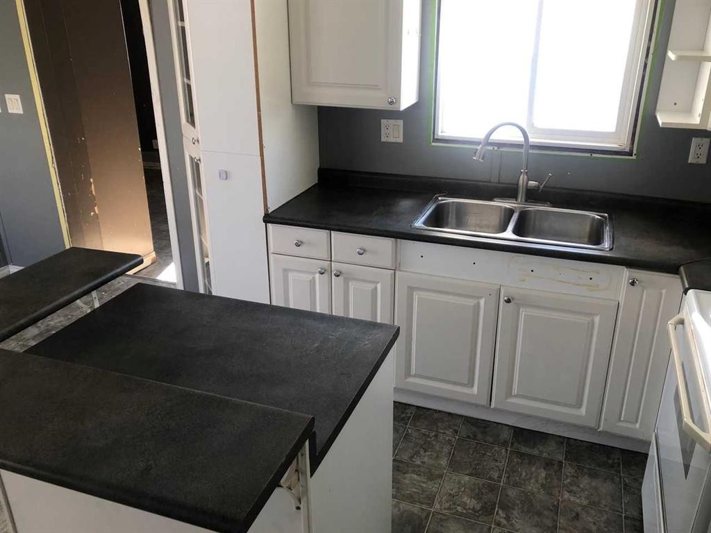 9908 105 Street, High Level, AB - Indoor Photo Showing Kitchen With Double Sink