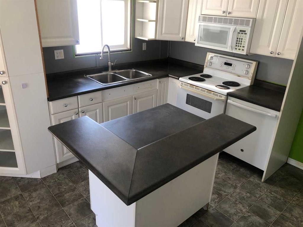 9908 105 Street, High Level, AB - Indoor Photo Showing Kitchen With Double Sink