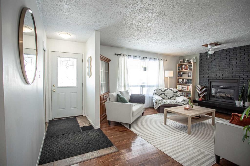 10403 106 Avenue, High Level, AB - Indoor Photo Showing Living Room With Fireplace