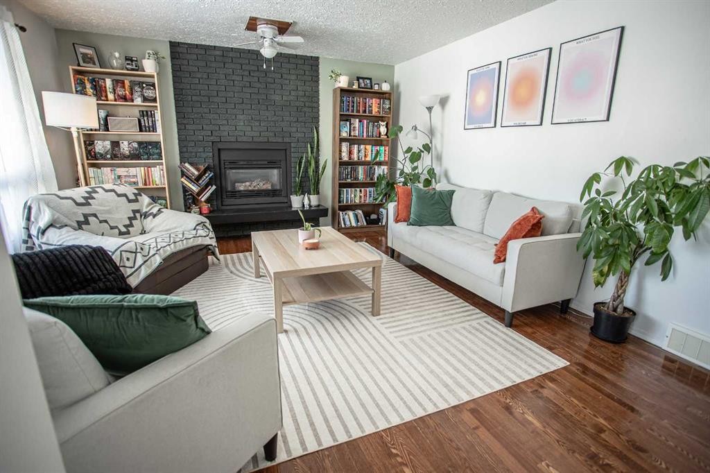 10403 106 Avenue, High Level, AB - Indoor Photo Showing Living Room With Fireplace