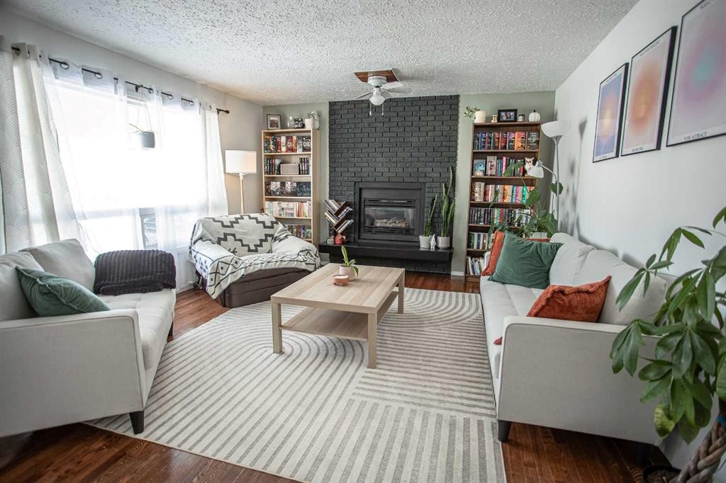 10403 106 Avenue, High Level, AB - Indoor Photo Showing Living Room With Fireplace