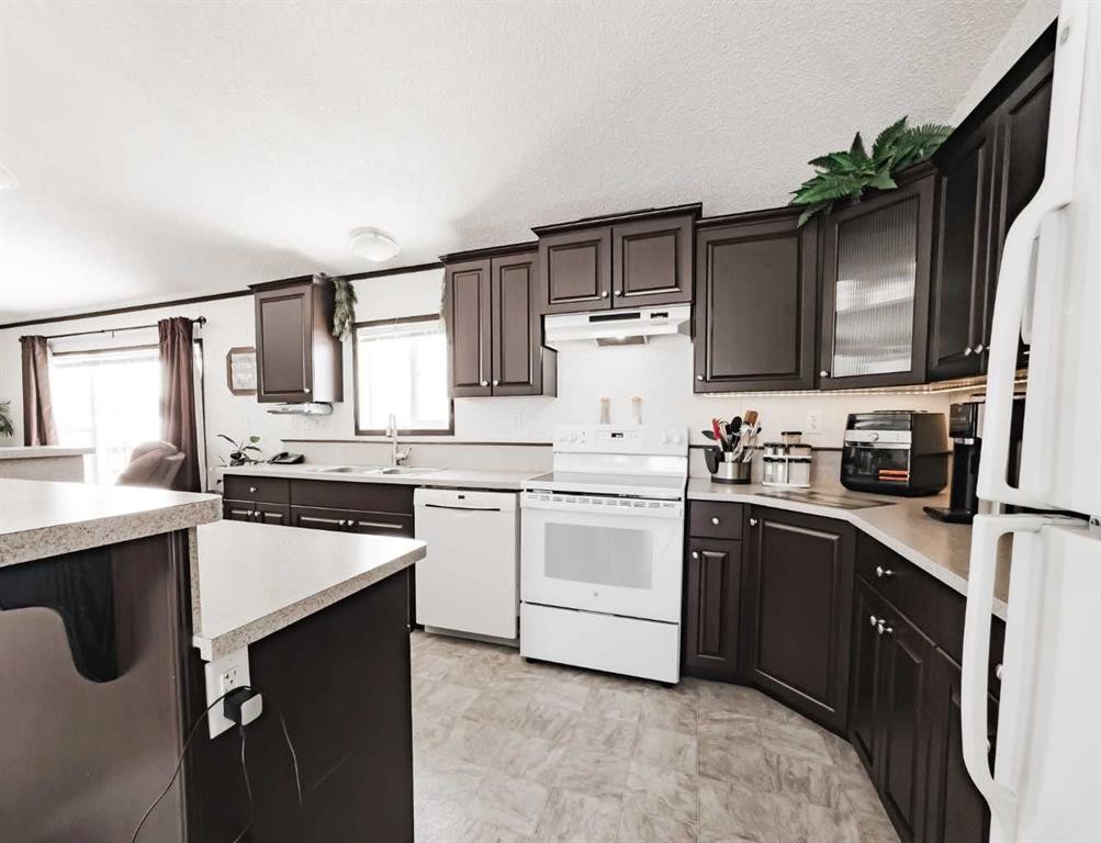 893029 Range Rd 232, Manning, AB - Indoor Photo Showing Kitchen With Double Sink