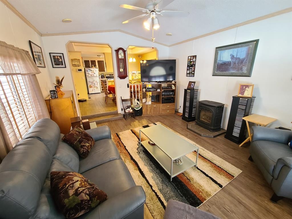 9909 80 Avenue, Peace River, AB - Indoor Photo Showing Living Room With Fireplace