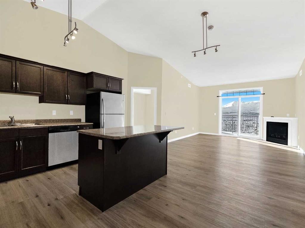 414-160 Moberly Road, Grande Cache, AB - Indoor Photo Showing Kitchen With Fireplace With Double Sink