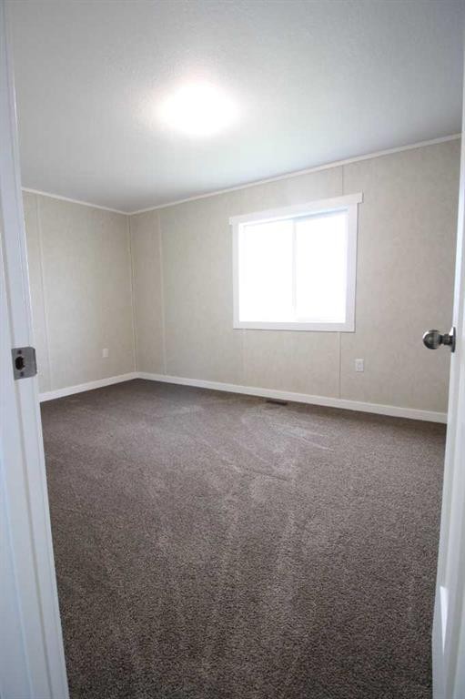 32 Deerglen, High Level, AB - Indoor Photo Showing Other Room