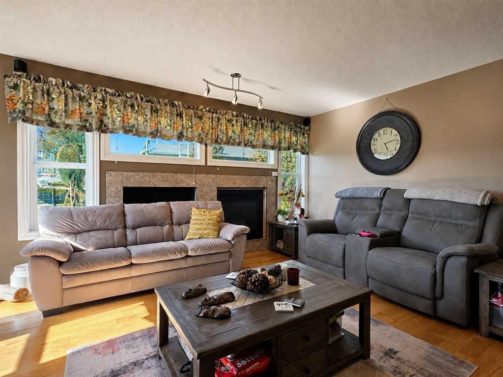 114 Moberly Road, Grande Cache, AB - Indoor Photo Showing Living Room With Fireplace