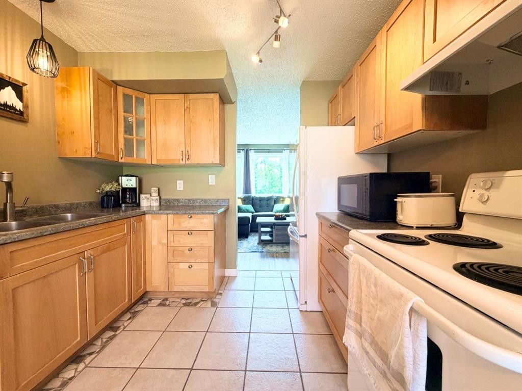 53 97 Avenue, Grande Cache, AB - Indoor Photo Showing Kitchen With Double Sink