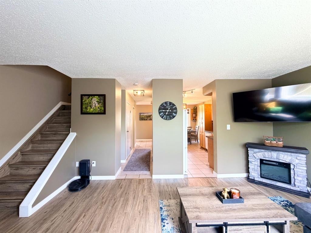 53 97 Avenue, Grande Cache, AB - Indoor Photo Showing Other Room With Fireplace