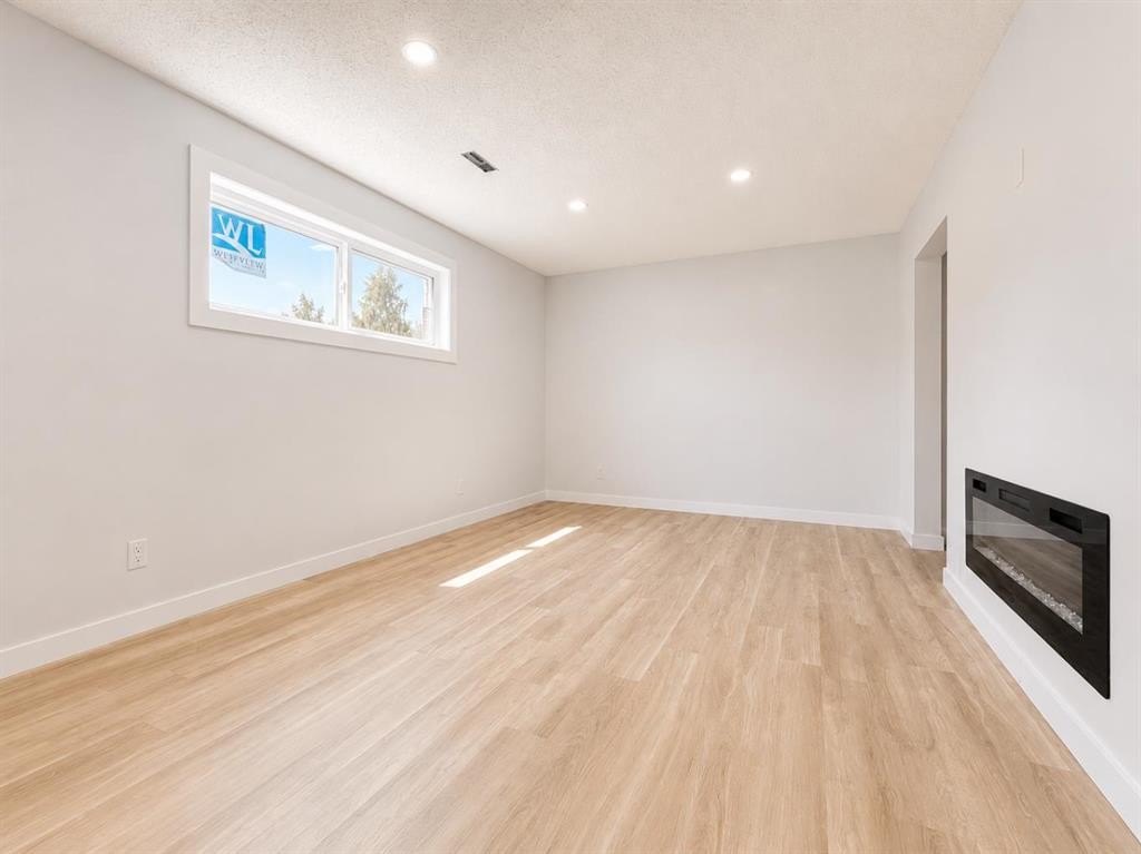 10902 97Th Avenue, Grande Cache, AB - Indoor Photo Showing Other Room With Fireplace