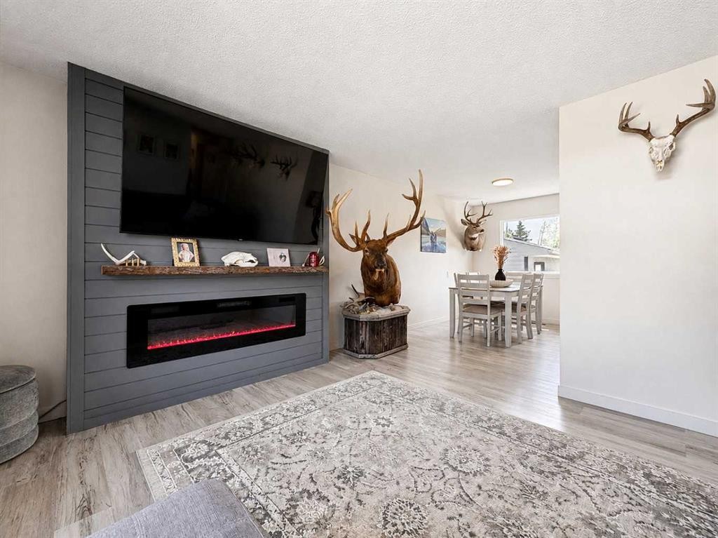 10237 97 Ave, Grande Cache, AB - Indoor Photo Showing Living Room With Fireplace
