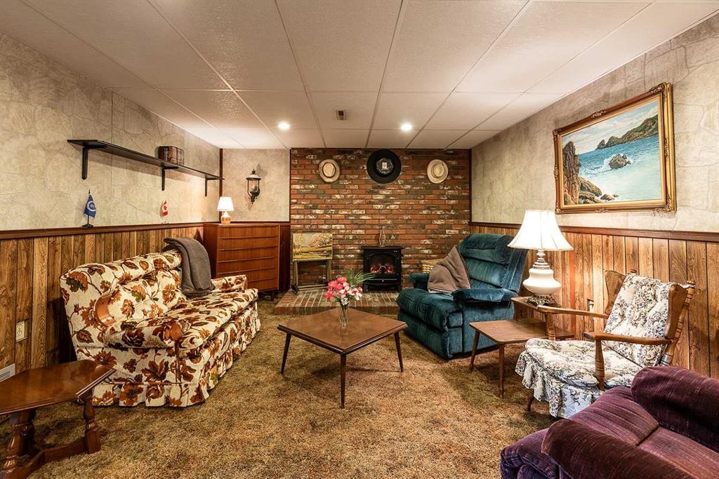 242 11Th Street Ne, Medicine Hat, AB - Indoor Photo Showing Living Room With Fireplace
