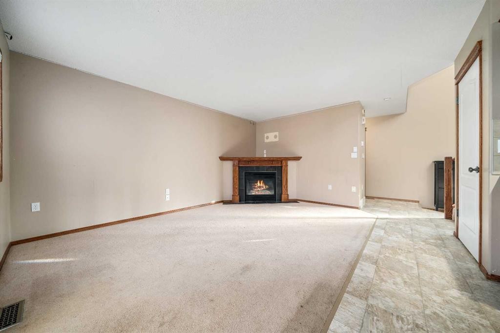 197 Vista Road, Medicine Hat, AB - Indoor Photo Showing Other Room With Fireplace