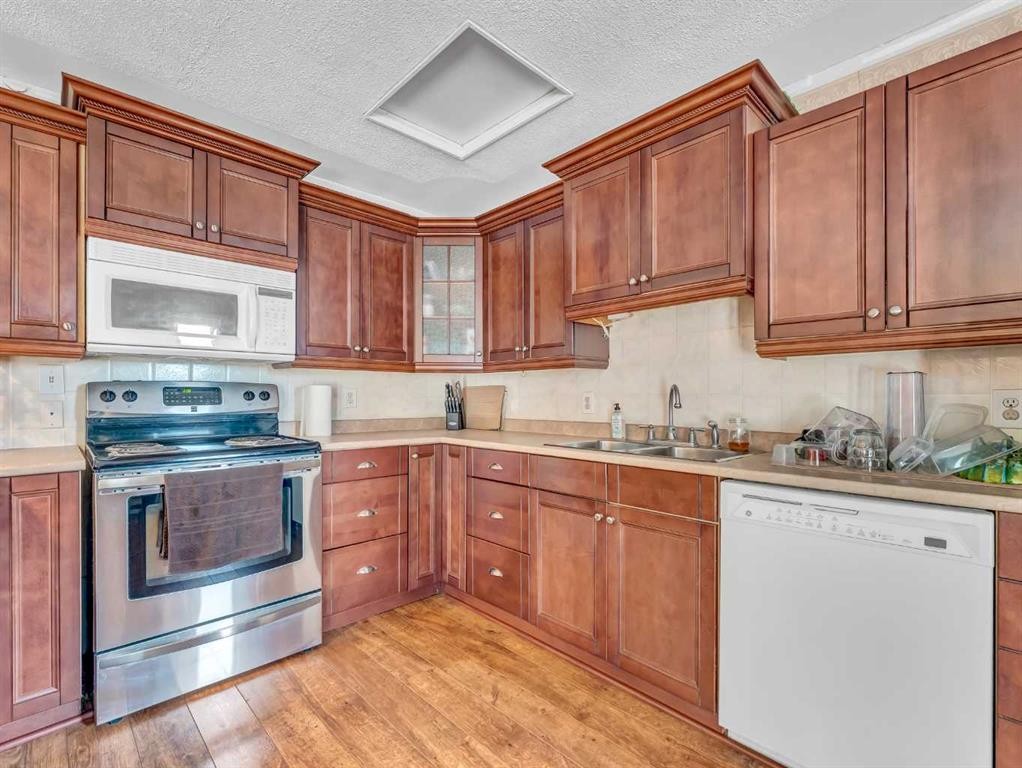6-12006 Range Road 43, Rural Cypress County, AB - Indoor Photo Showing Kitchen With Double Sink