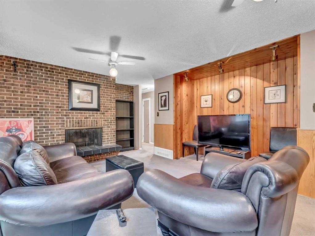2210 Upland Drive Se, Medicine Hat, AB - Indoor Photo Showing Living Room With Fireplace
