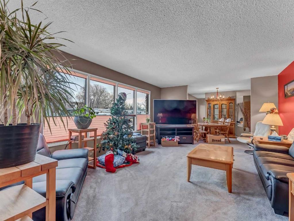 2210 Upland Drive Se, Medicine Hat, AB - Indoor Photo Showing Living Room With Fireplace