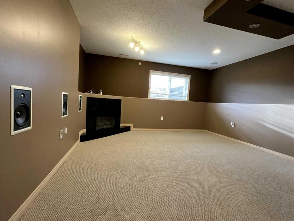 260 Sierra Drive Sw, Medicine Hat, AB - Indoor Photo Showing Other Room With Fireplace
