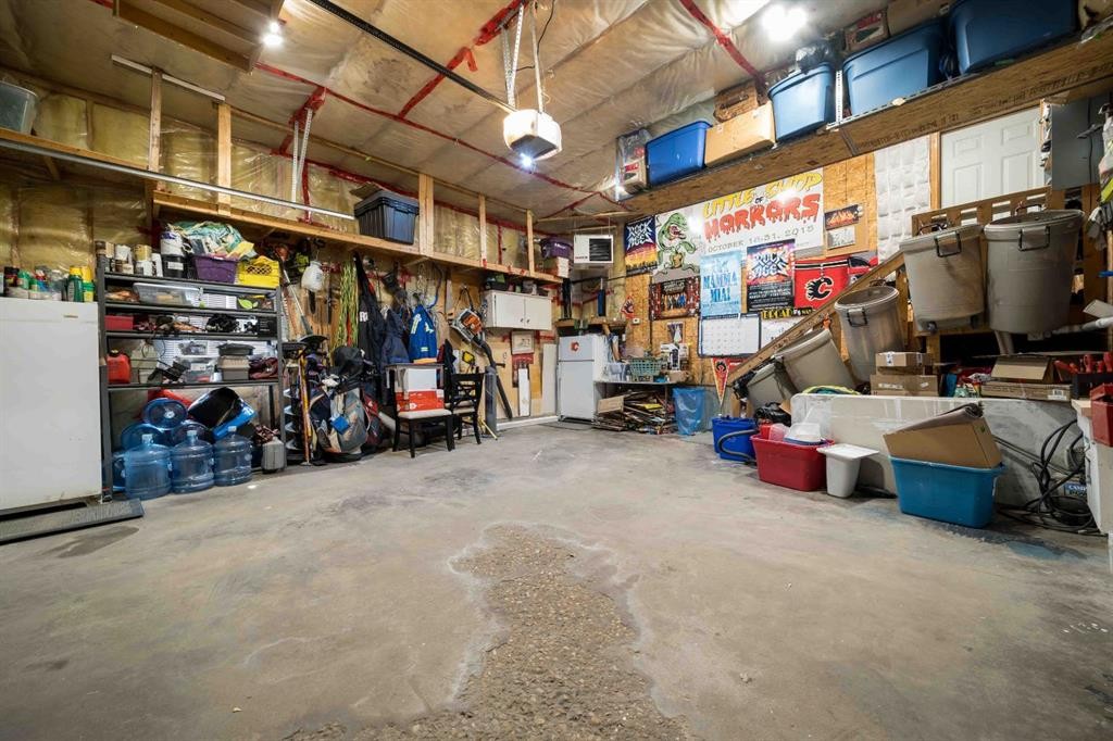 110 Redcliff Way Sw, Redcliff, AB - Indoor Photo Showing Garage